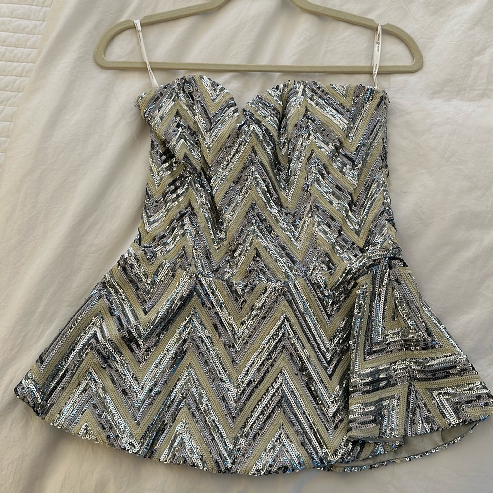 Sequin peplum top by Julie Brown in size 2.